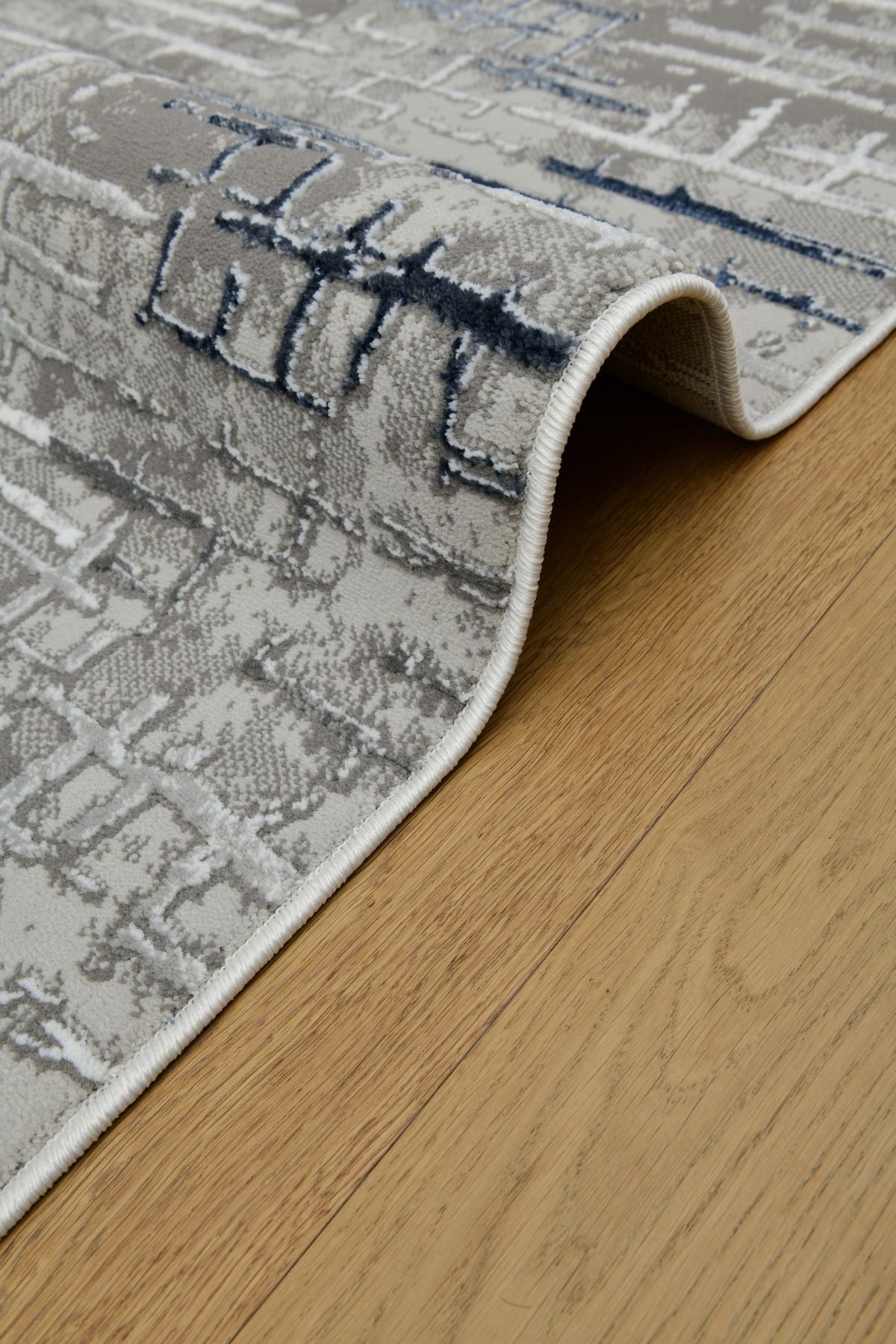 Astra GrafitBlå – Urban struktur i modern tappning